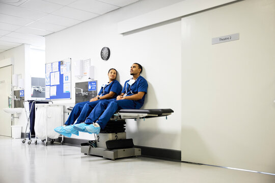 Doctors Sitting Inside a Hospital Near Operating Room