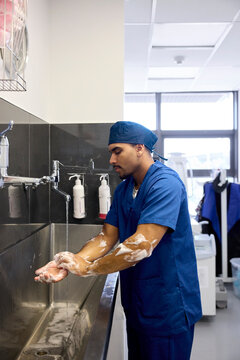 Doctor Cleans Hands Before Patient Care