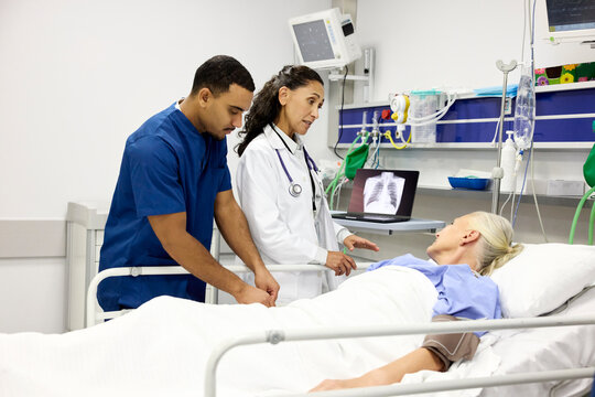 Hospital Staff Assist Patient in Medical Care