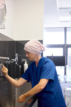 Hospital Doctor Washing Hands Before Patient Care