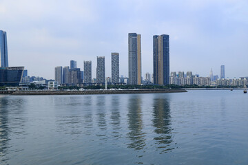 Obraz premium Modern Waterfront City Skyline with High-Rise Towers