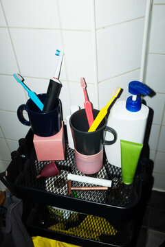 Daily life hygiene items toothbrushes toothpaste on a shelf 