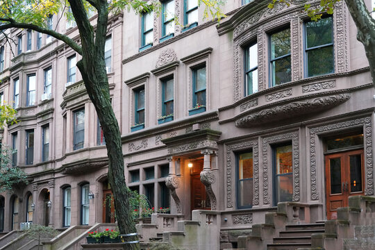 Manhattan street with old brownstone style townhouses