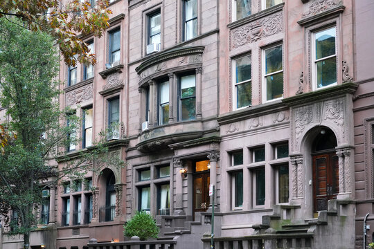 Manhattan street with old brownstone style townhouses