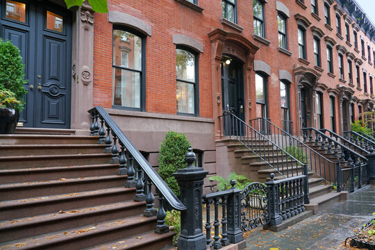Manhattan street with old brownstone style townhouses