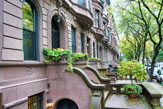 Manhattan street with old brownstone style townhouses