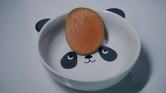 ripe mango slice in bowl 