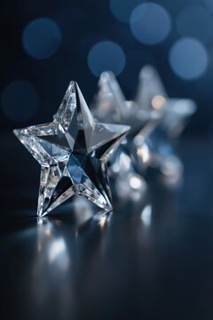 Glass star ornament resting on glossy surface with bokeh