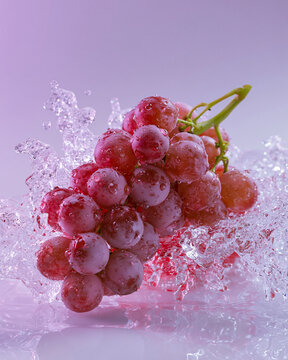 bunch of grapes splash on the water