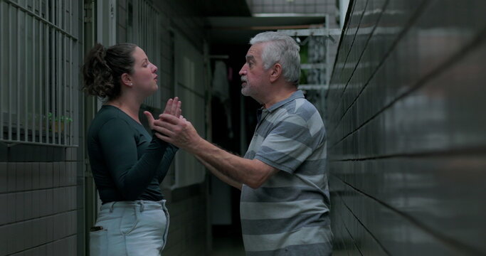 Adult daughter talking openly to elderly father outdoors expressing concern frustration and need for reassurance while he listens calmly offering support and family teamwork