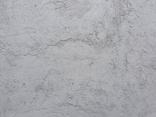 Grey textured concrete wall with rough stone material, perfect for industrial backgrounds in construction projects or design elements. Suitable for architectural presentations. © Dinamartina93