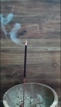 Burning incense releases fragrant smoke that is often used for aromatherapy and religious rituals