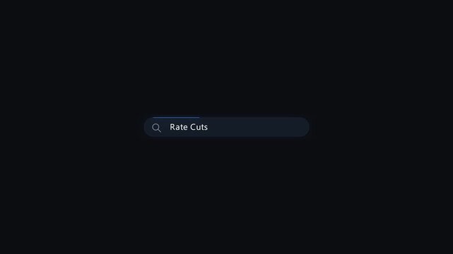Digital search bar typing rate cuts query for financial news and economic analysis