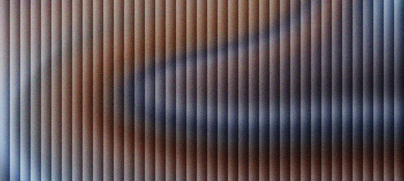 Abstract fluted glass texture with vertical lines and soft shadows, ribbed glass panel with brown and grey color gradients, architectural glass surface for interior design and web backgrounds.