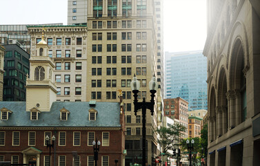 Fototapeta premium The corner of Court and State streets in downtown Boston with the Old State House at lower left