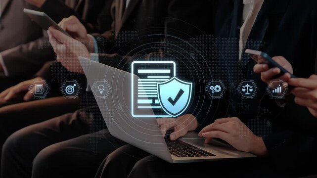 Business professionals engage with technology in an office setting, highlighting concepts of digital security, data protection, and teamwork in a modern workplace. Raster