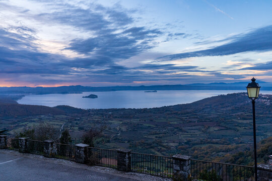 Panoramic sunset over Lake Bolsena from a scenic road, Italy