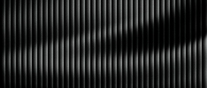 Abstract black metal texture with vertical slats and cinematic lighting. Dark industrial background featuring rhythmic metallic lines. Minimalist architectural pattern for modern web design.