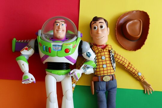 Salvador, Brazil - June 15, 2026: Sheriff Woody and Buzz Lightyear toys on a colorful background. Toy Story movie concept.