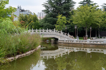 Fototapeta premium Marble bridge and pond near of museum garden of Xi'an museum on Youyi West Road, Beilin District, Xi'an, Shaanxi, China
