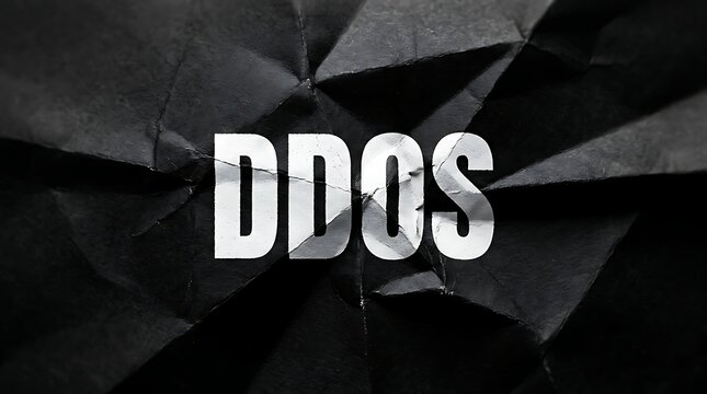 DDOS text concept with white letters on a dark black crumpled paper background.