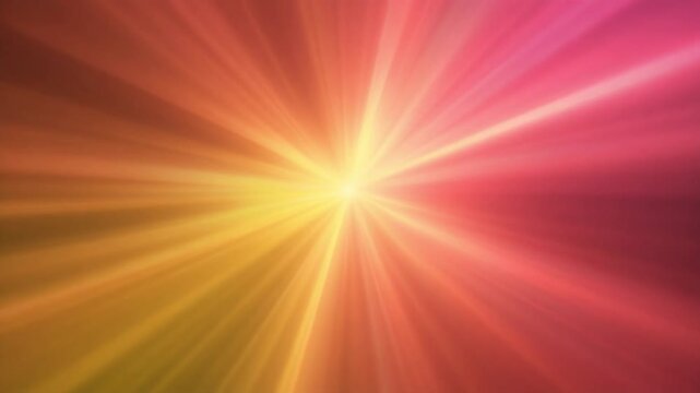 Abstract seamless loop of vibrant yellow and red or pink radial light rays shining from the center for a bright cinematic sunburst background or backdrop