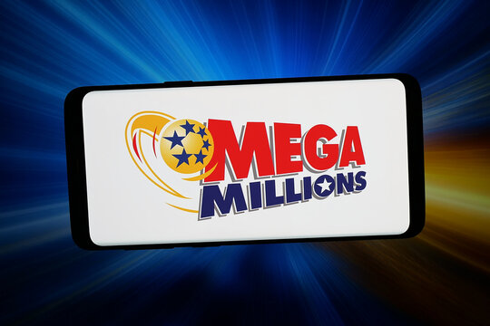 Stuttgart, Germany - 06-10-2026: In this photo illustration, the logo of US lottery game Mega Millions (MegaMillions) is displayed on a smartphone in front of abstract background on computer screen.