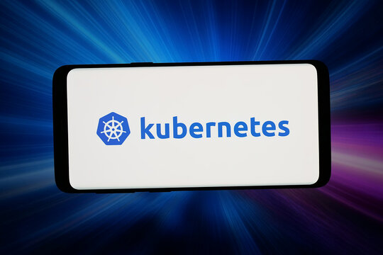 Stuttgart, Germany - 06-10-2026: In this photo illustration, the logo of container orchestration software Kubernetes is displayed on a smartphone in front of abstract background on computer screen.