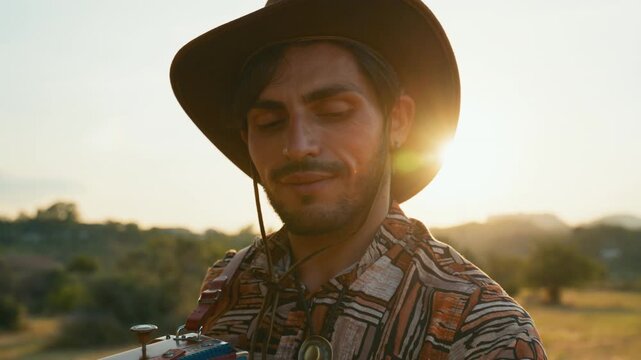 Calabrian man playing the accordion traditional instrument wearing a hat outdoor