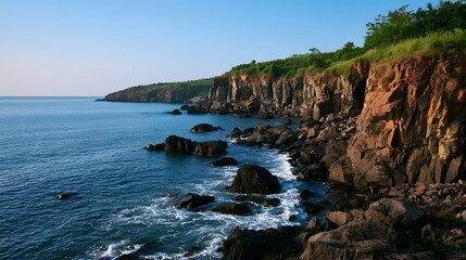 Obraz premium A breathtaking scenic cliff view bathed in crisp evening light creates a peaceful and dramatic atmosphere