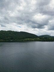 Fototapeta premium Aerial View of Lake Districts Valley and Mountains of UK. Drone Camera View Was Captured From Medium High Altitude During Mostly Dramatic Cloudy Day of Summer 2026