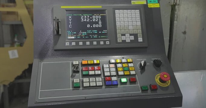 CNC Machine Control Panel in Industrial Workshop. Close Up of CNC Control System on Metalworking Machine