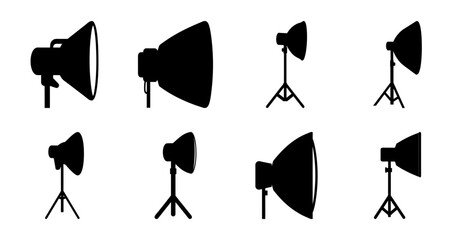 Black studio lighting equipment set - Eight black studio lights and stands arranged neatly for photography or video production. © Md
