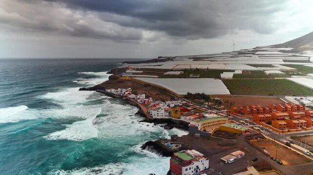Aerial pull back over crashing waves, El Agujero, Galdar, Gran Canaria