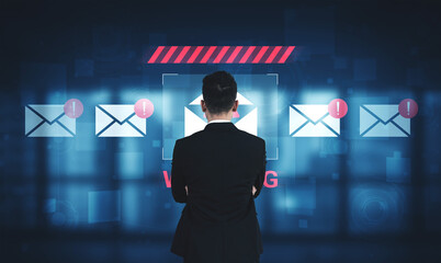 A businessman stands in front of a digital interface displaying email notifications, emphasizing the importance of communication safety and monitoring in modern workplaces. Gantry © InfiniteFlow