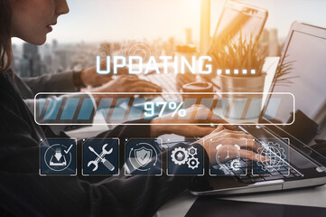 Fototapeta premium Modern Workspace with User Updating Software on Laptop with Progress Bar and Digital Icons Representing Technology and Productivity in a Bright Environment Sigmoid