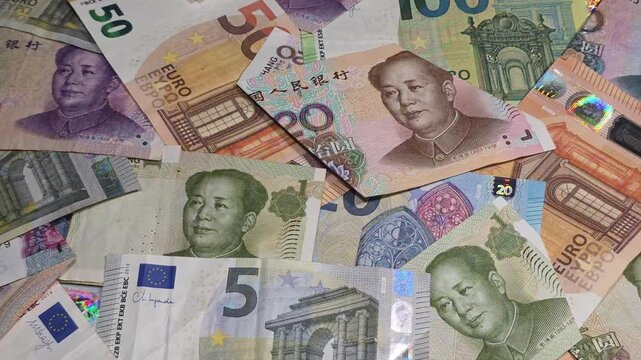 panning shot of collage with euro and Chinese yuan banknotes