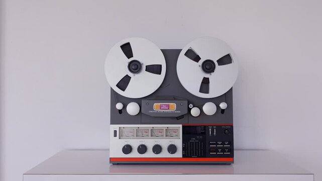 Reel Music Analog Studio Cassette Tape Recording Machine in Bright White Rooms 4k 60fps