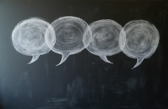 Four chalk speech bubbles drawn on blackboard. Represents communication discussion ideas and conversation. Simple clean design for messaging concepts.