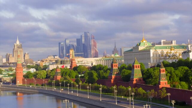 Beautiful panoramic view of the Moscow Kremlin, Moskva River, and modern city skyline at sunrise