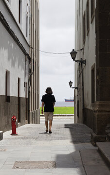 Man in Bleach-Stamped T-Shirt in Historic Vegueta, Las Palmas
