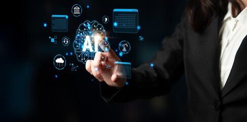 Fototapeta premium Business professional interacting with futuristic artificial intelligence interface with digital icons and data analytics visualizations in dark background Haptic.