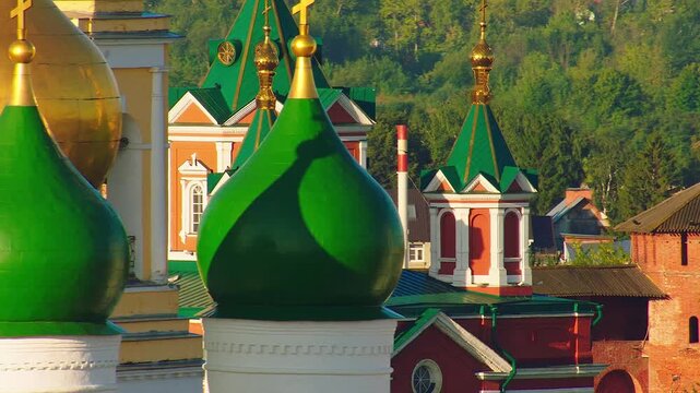 Moving shadow on the green domes of Trinity Lavra of St. Sergius in Russia