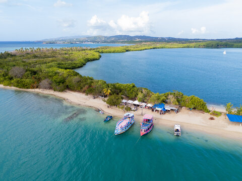 Drone View of Sandy Beach and Colourful Boats Tobago