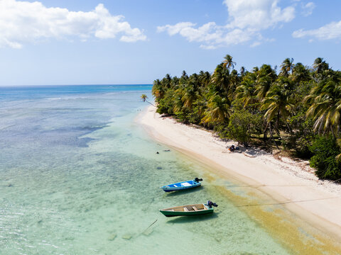 Drone View of Sandy Spit with Boats and Palm Trees Tobago