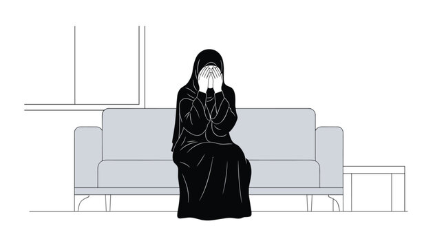Woman wearing a black niqab sitting on a grey sofa and covering her face with her hands expressing deep sadness or grief in a quiet indoor setting.