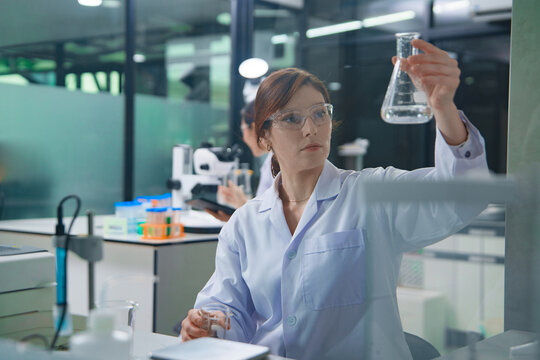 Scientist Conducting Research with Liquid Sample in Laboratory