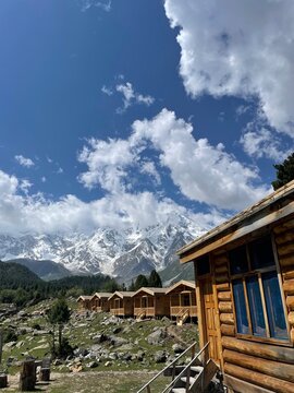 [11:08 pm, 31/05/2026] syed ali: 9
[11:08 pm, 31/05/2026] syed ali: Traditional Wooden Cabin with Snowy Mountain Peaks and Blue Sky Backdrop