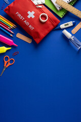 Naklejka premium First aid kit and school safety supplies for student health and classroom emergencies on vertical blue table