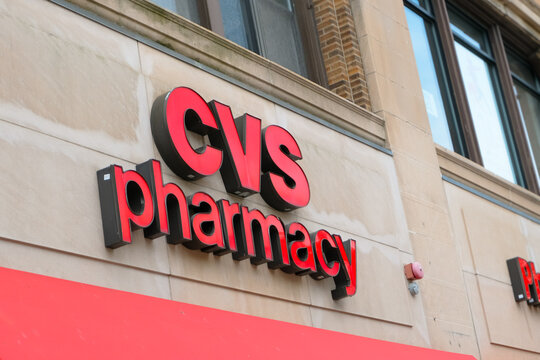 Boston, USA - 27 May 2026. Red CVS Pharmacy sign on a city building facade.
